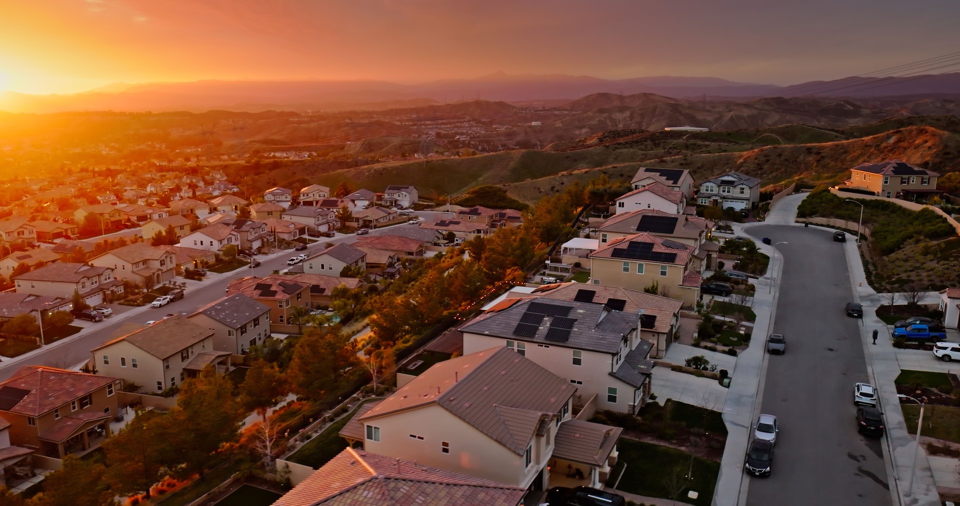 High Angle View of Suburban Santa Clarita Housing with a Sunset Beyond